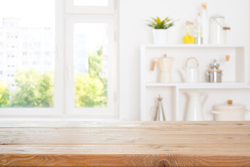 Obraz premium Kitchen wooden empty table for product display on bright modern interior with window view background