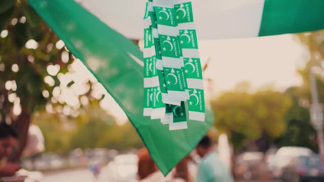 Detail Shot of Pakistani Flag Print Stoles Hanging Under Market Awning During Independence Day