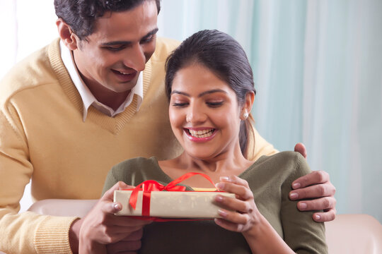 Woman receiving a gift on Valentines Day