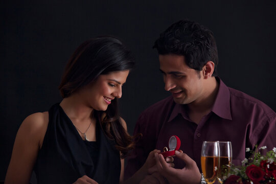 Man proposing to woman on Valentines Day