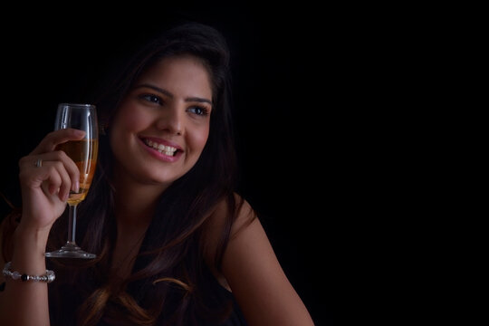 Woman with a glass of wine smiling