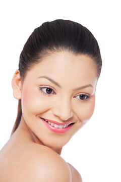 Smiling young woman looking down 