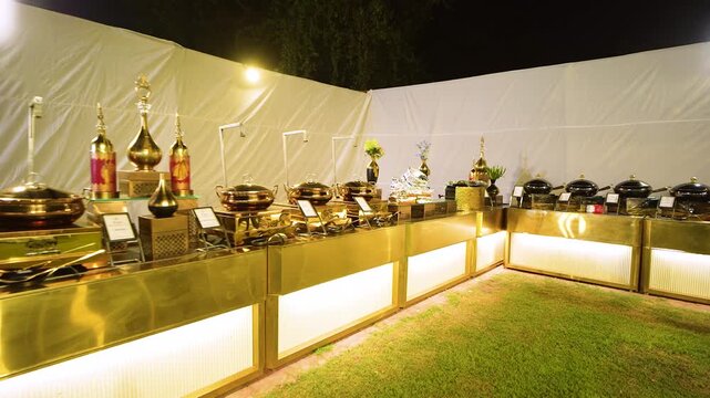 Luxury wedding buffet catering setup with golden chafing dishes in Uttarakhand India