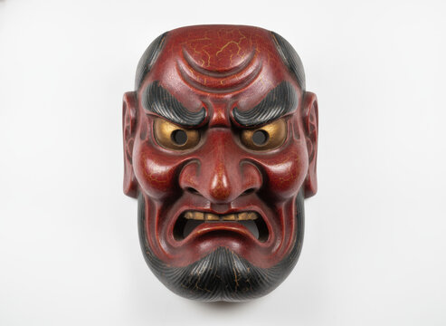 Traditional Japanese Red Tengu Mask Isolated on White Background, concept of japanese folklore and cultural heritage