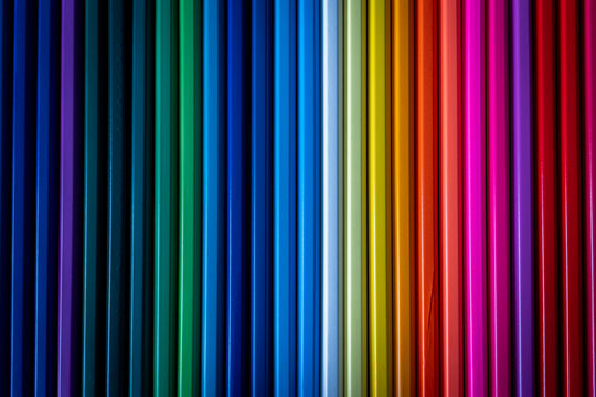 Vertical Colored Pencils Create a Bold Rainbow Stripe Background
