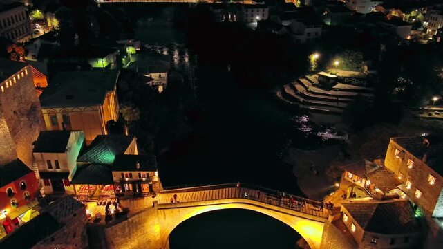 Aerial view on the Old Bridge in Mostar at night, Bosnia and Herzegovina, 4k