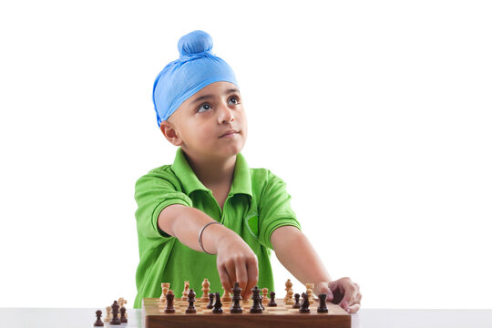 Sikh boy playing chess 