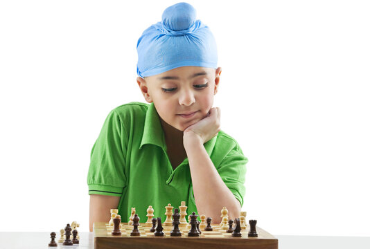 Sikh boy playing chess 