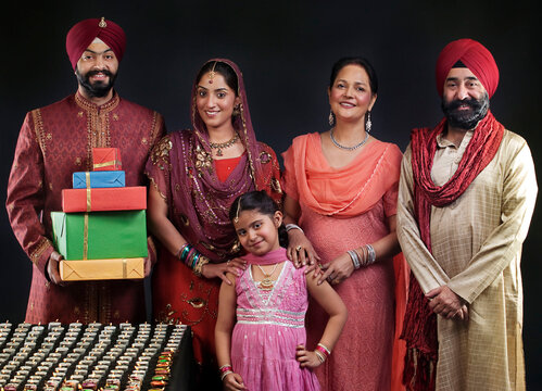 Portrait of a Sikh family with diyas 