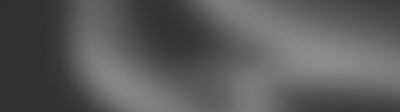 Monochrome black and grey abstract gradient background with smooth flowing silk wave texture and grainy noise for moody minimal modern elegant design