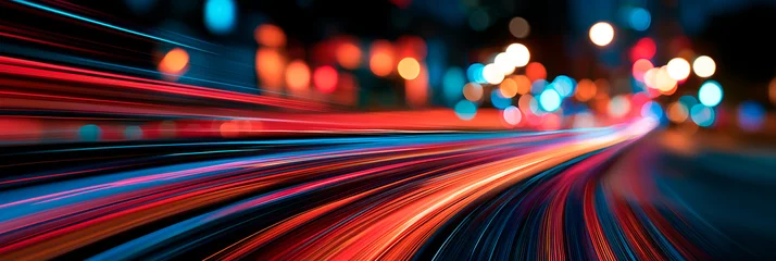 Dynamic long exposure photograph of vibrant car light trails forming abstract patterns at a busy city intersection at. banner © Enrique