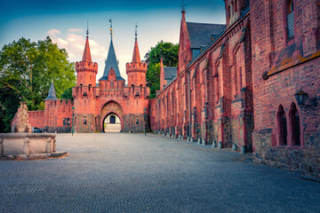 Fototapeta premium Impressive evening view of old red brick castle. Beautiful summer csene of Hradec nad Moravici castle, Moravian-Silesian Region, Czech Republic. Traveling concept background.