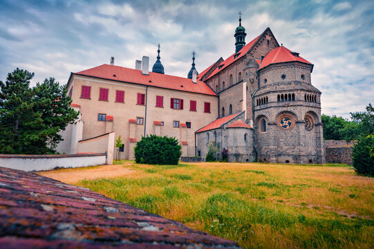 Dramatic morning view of St. Procopius Basilica 12th-century basilica and former monastery on a hilltop above the Jewish Quarter. Splendid summer cityscape of Trebic town,, Czech Republic. 