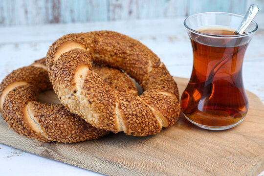 simit bagels on the and and glass of tea	