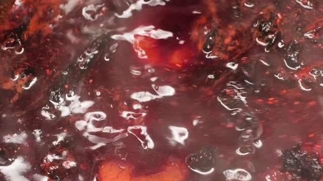 Close up cooking footage showing chamoy recipe cooking in pot during a homemade chamoy sauce recipe prepared from scratch