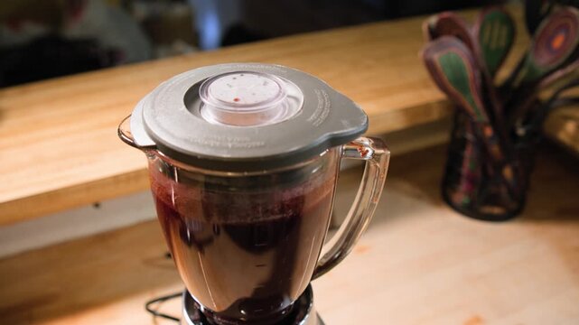 Close up cooking footage showing blending ingredients for chamoy during a homemade chamoy sauce recipe prepared from scratch