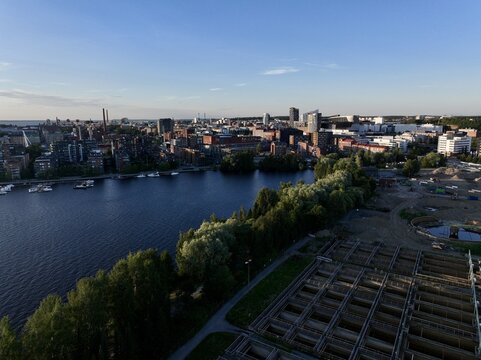 Aerial view of the city of Tampere with its urban architecture, riverfront, and surrounding greenery in Tampere, Pirkanmaa, Finland.
