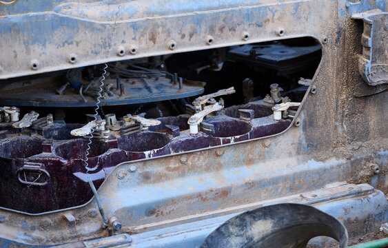 A close-up of the autoloader carousel and internal mechanisms of a destroyed Russian T-72 tank, covered in mud and rust.