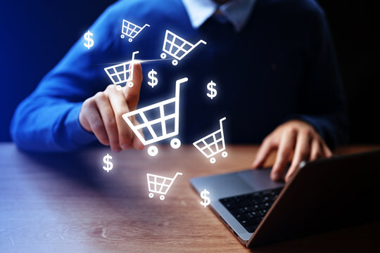Online shopping experience with a person at a laptop in a home setting at daytime