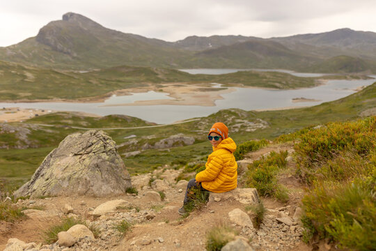Family, kid, dog, brothers hiking in amazing Jotunheimen National Park in Norway, Synshorn Mountain