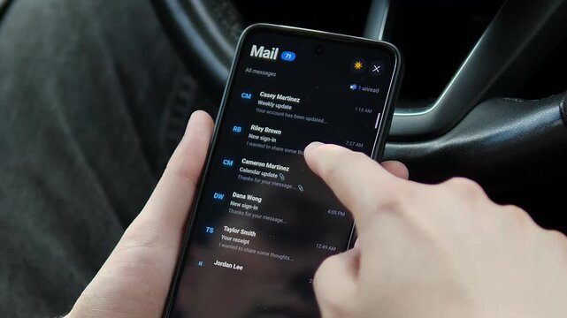 Person scrolls through a busy mobile inbox, highlighting email overload, constant digital communication and the challenge of managing messages in an always-connected workday.