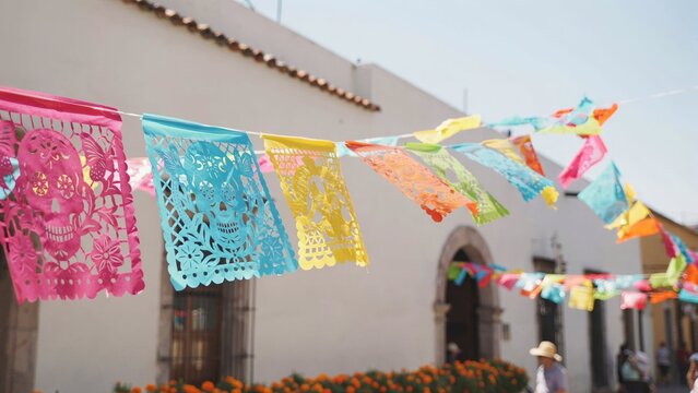 Colorful Papel Picado Banners Hanging Outdoors for Traditional Mexican Celebration