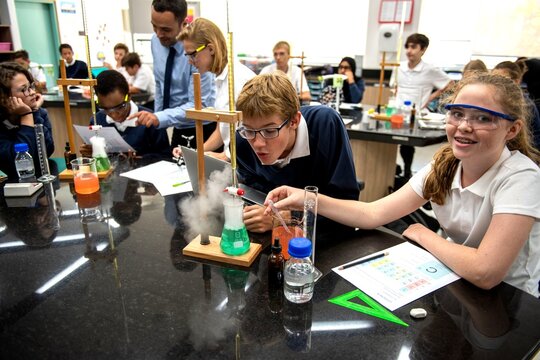 Engaged students conducting science experiments.