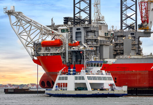 Offshore Installation Vessel and Ferry in the Harbor