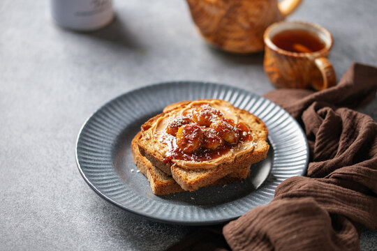 Winter toast with peanut butter and caramelized bananas topped with coconut flakes