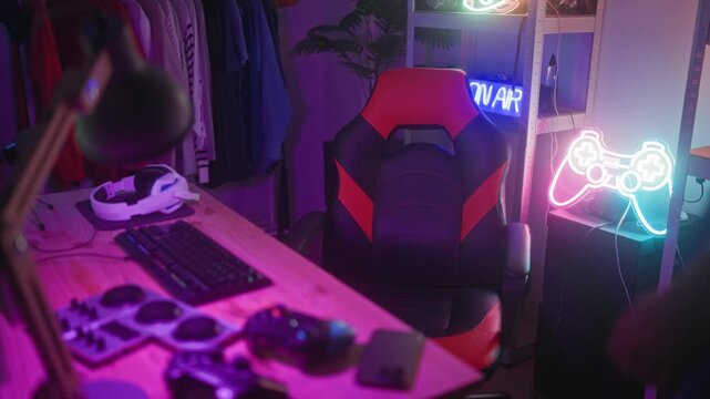 Man reaches for mouse and puts on headset at a neon lit gaming studio, leaning over keyboard; concentration immersion session.