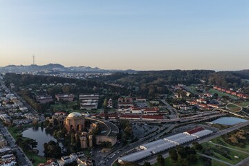 Fototapeta premium Aerial view of San Francisco's Palace of Fine Arts near the Golden Gate Bridge at golden hour. g.