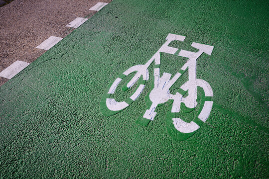 Closeup of the sign drawn on the ground indicating a bike lane.