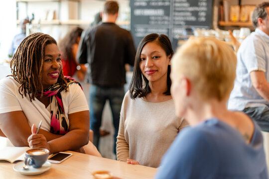 Diverse group enjoying coffee conversation