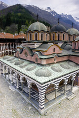 The Rila Monastery, a UNESCO World Heritage site in Bulgaria, showcases its stunning architecture with multiple domes. © Nick