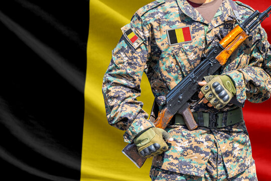 Belgium flag with soldier holding assault rifle