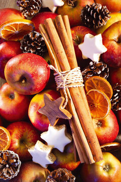 Apples, christmas cookies and cinnamon sticks