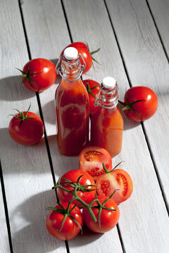 Homemade tomato juice on wooden table