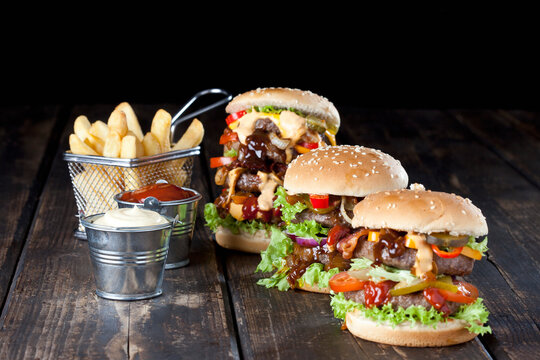 Large hamburger with fries, mayonnaise and ketchup