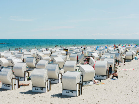 Germany,Ruegen, Binz, People in beach booth at Island of Rugen