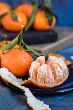 Clementines on plate, peeled