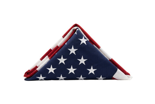 Folded American flag in traditional triangular military ceremonial fold with stars showing cutout isolated.