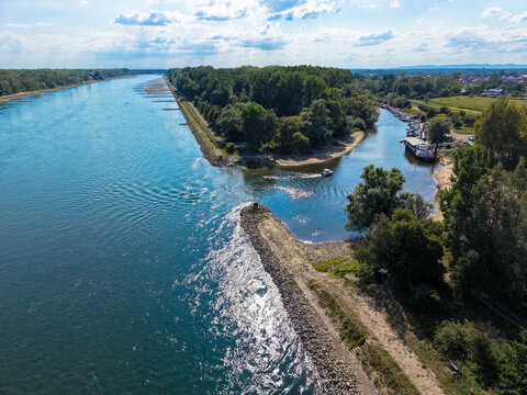 Aerial view of the Rhine at low water near the small harbor of the town of Neuburg am Rhein. Prolonged dry weather is causing extremely low water levels on the Rhine. This is having a significant impa