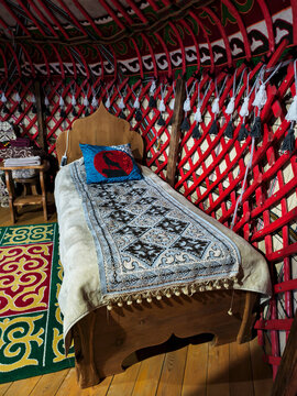 Bed Inside a Kyrgyz yurt. Traditional national dwelling of nomads.