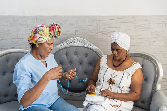 Multigenerational women sharing crafting hobby together at home