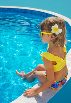 A child resting near a pool. Selective focus.