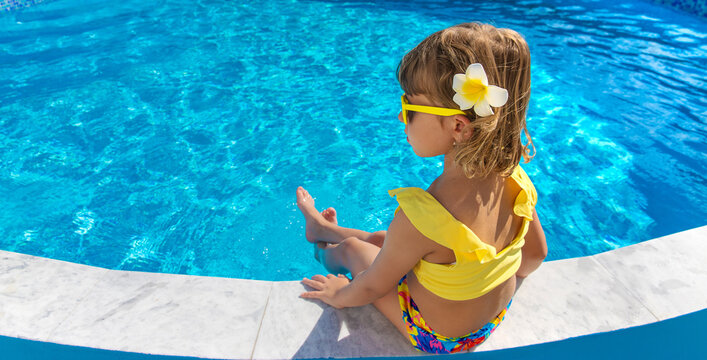 A child resting near a pool. Selective focus.