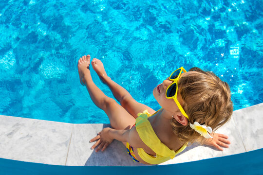 A child resting near a pool. Selective focus.