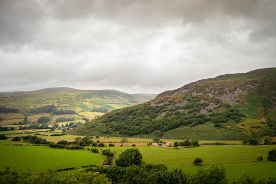 Rugged Welsh mountain landscape heavy overcast clouds misty distant peaks and rolling hills