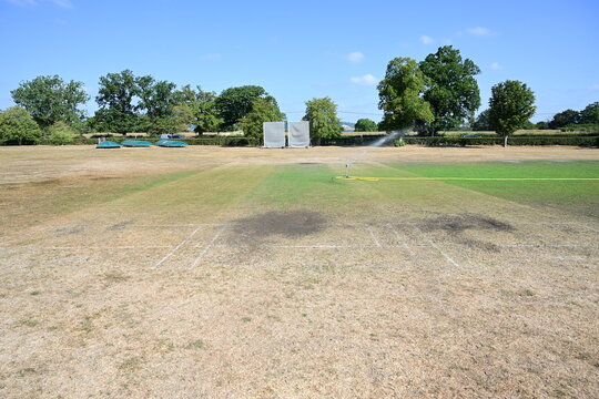The Crease on a Cricket Pitch being irrigated during the heatwave of August 11th 2026 in Surrey in the UK. 