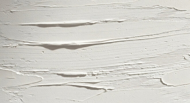 Thick texture of white plaster creates an abstract background for interior design and minimalist artistic wall renovation